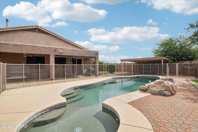 view of swimming pool featuring a patio area and a jacuzzi