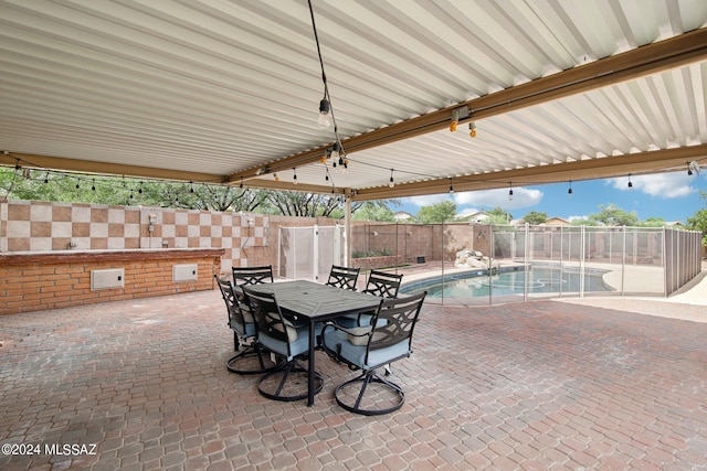 view of patio featuring a fenced in pool