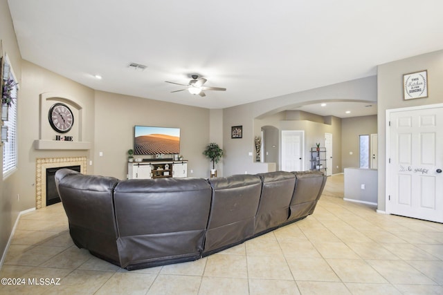 living room featuring ceiling fan and light tile patterned floors