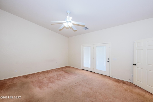 empty room featuring visible vents, baseboards, ceiling fan, and light carpet