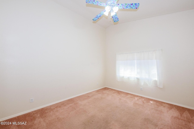 carpeted empty room featuring baseboards and a ceiling fan