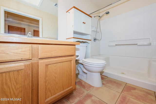 full bathroom featuring tile patterned flooring, vanity, toilet, a shower, and visible vents