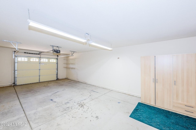 garage featuring baseboards and a garage door opener