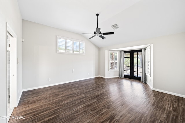 spare room featuring dark hardwood / wood-style flooring, ceiling fan, french doors, and vaulted ceiling