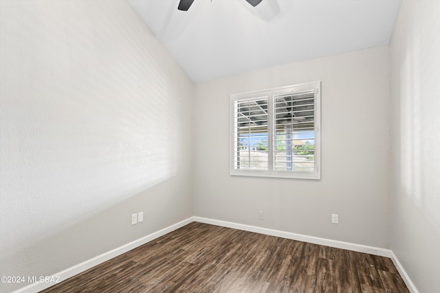 unfurnished room featuring ceiling fan, dark wood-type flooring, and lofted ceiling