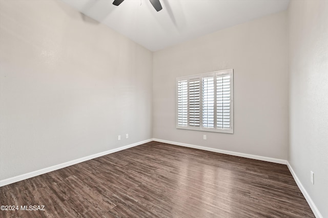 empty room featuring ceiling fan and dark hardwood / wood-style floors