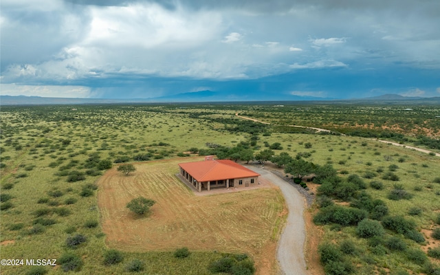 birds eye view of property with a rural view and a mountain view