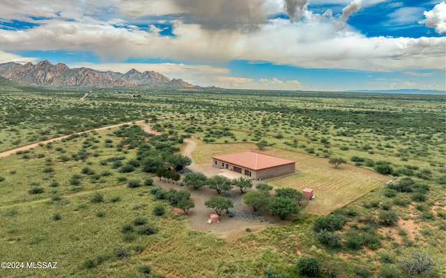 birds eye view of property featuring a mountain view and a rural view