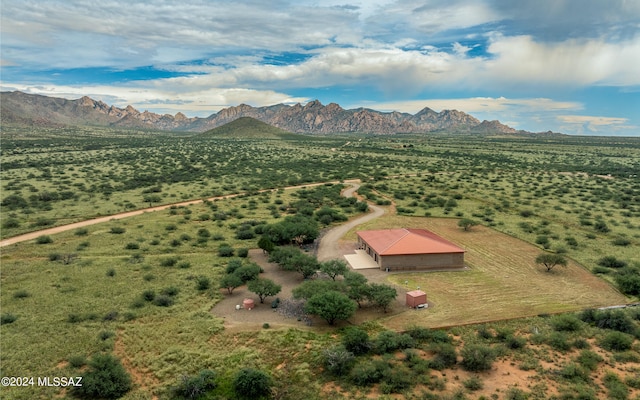 birds eye view of property with a mountain view