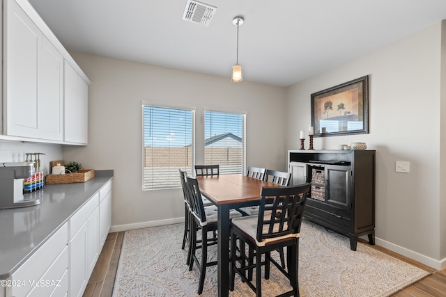 dining area with light hardwood / wood-style floors