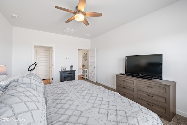 carpeted bedroom featuring ceiling fan