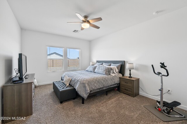 bedroom featuring ceiling fan and carpet