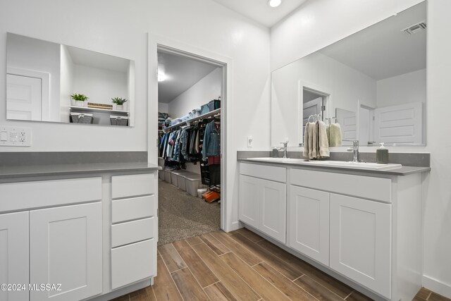 bathroom featuring vanity and wood-type flooring