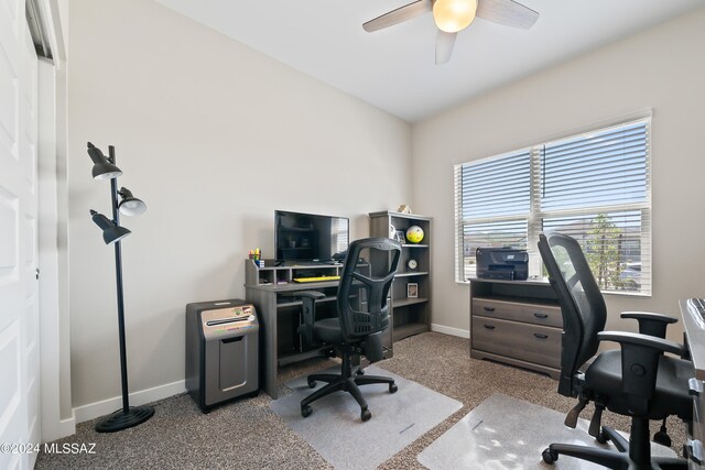 home office featuring ceiling fan and carpet