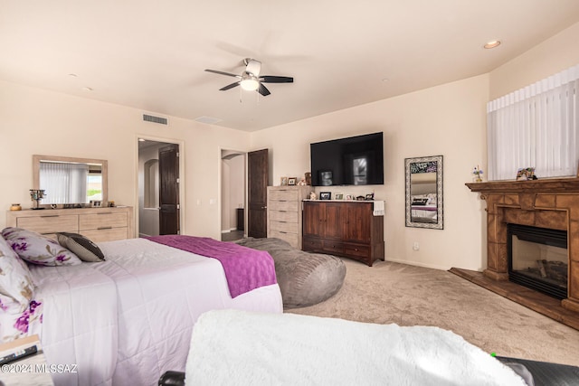 bedroom with ceiling fan and carpet floors