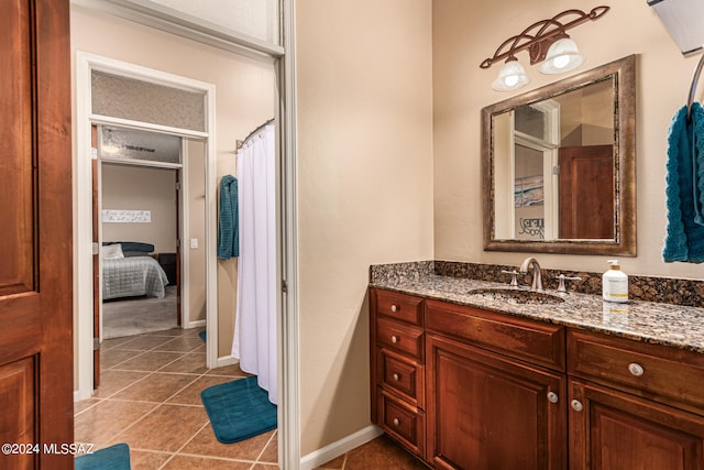 bathroom featuring tile patterned flooring and vanity