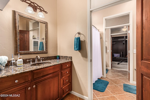 bathroom with vanity and tile patterned flooring