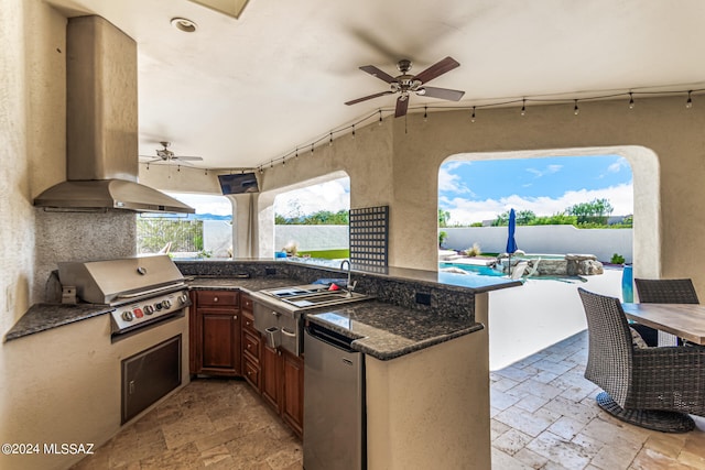 view of patio / terrace featuring exterior kitchen, a grill, sink, and ceiling fan