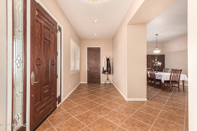 foyer entrance with tile patterned flooring