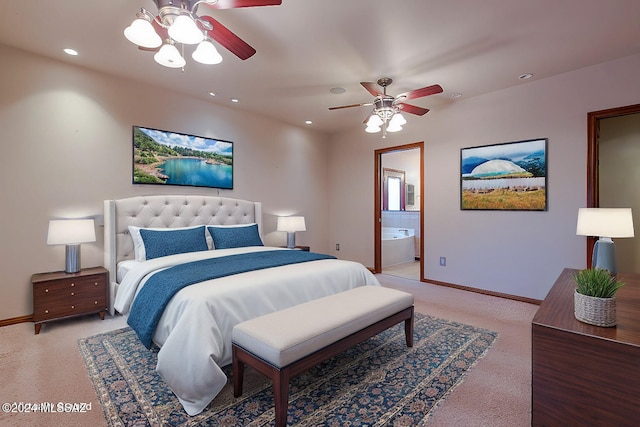 bedroom with a ceiling fan, baseboards, recessed lighting, light colored carpet, and connected bathroom