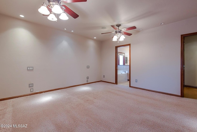 spare room featuring recessed lighting, baseboards, light colored carpet, and a ceiling fan