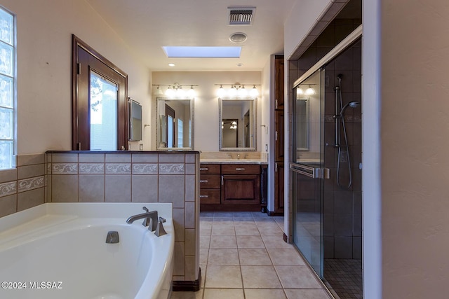 bathroom with a bath, visible vents, a shower stall, and tile patterned floors