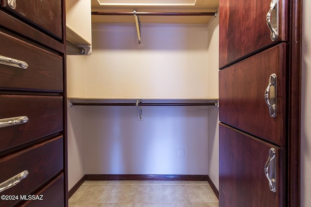 walk in closet featuring light tile patterned floors