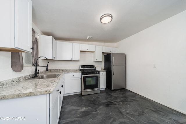 kitchen with sink, white cabinets, and stainless steel appliances
