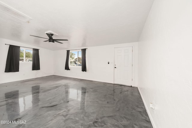 spare room with ceiling fan and a textured ceiling