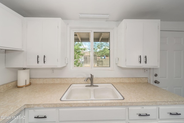 kitchen with sink and white cabinets