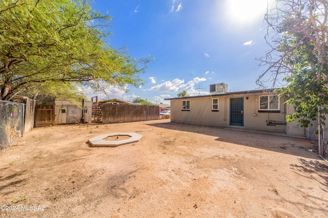 view of yard featuring a patio and an outdoor fire pit