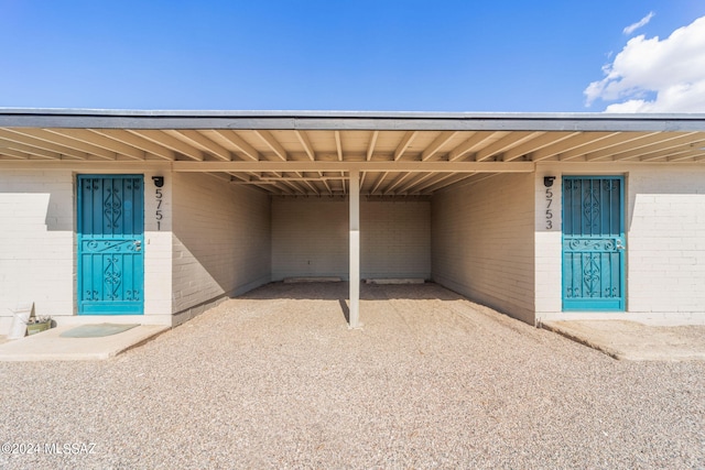 entrance to property featuring a carport