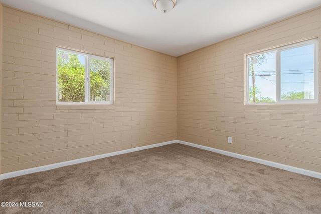 empty room with light colored carpet