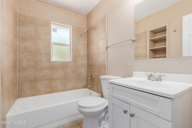 full bathroom with tiled shower / bath, toilet, tile patterned flooring, and vanity