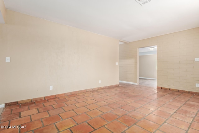 empty room with light tile patterned floors