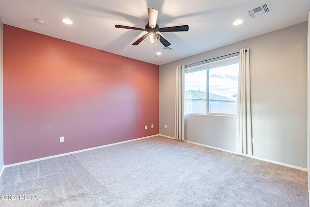 unfurnished room with recessed lighting, a ceiling fan, visible vents, baseboards, and carpet