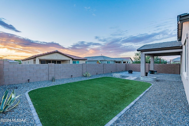 view of yard featuring a fenced backyard and a patio