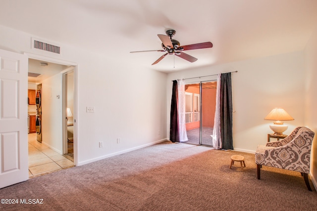 unfurnished room with light carpet and ceiling fan