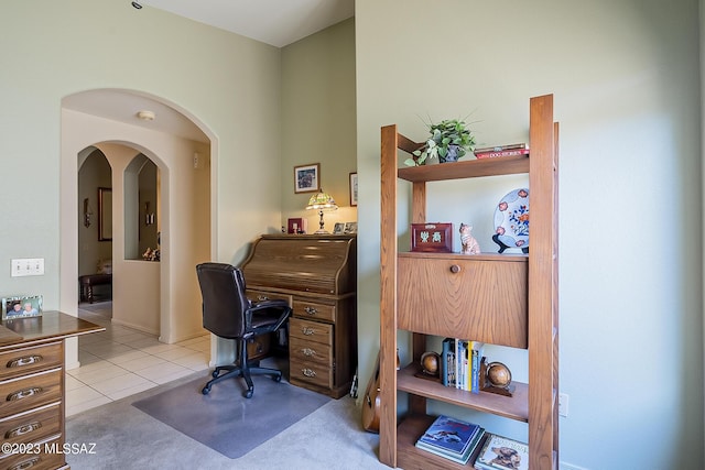 tiled home office with arched walkways