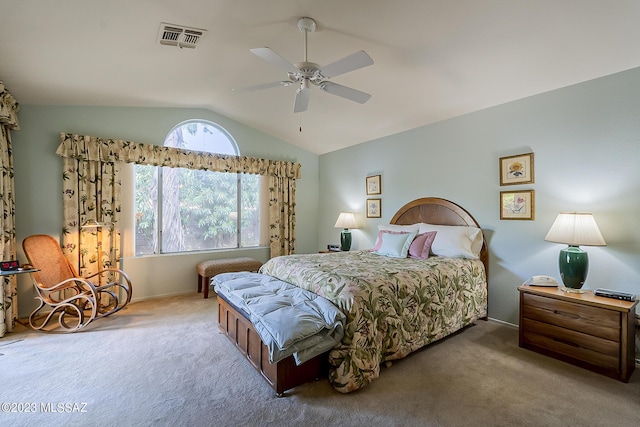 bedroom with a ceiling fan, visible vents, vaulted ceiling, and carpet flooring