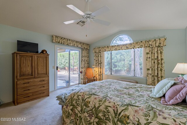 bedroom with access to exterior, vaulted ceiling, light colored carpet, and ceiling fan