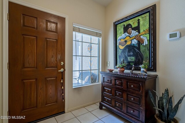 entrance foyer with light tile patterned floors