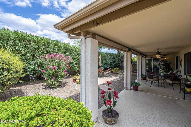 view of patio featuring ceiling fan