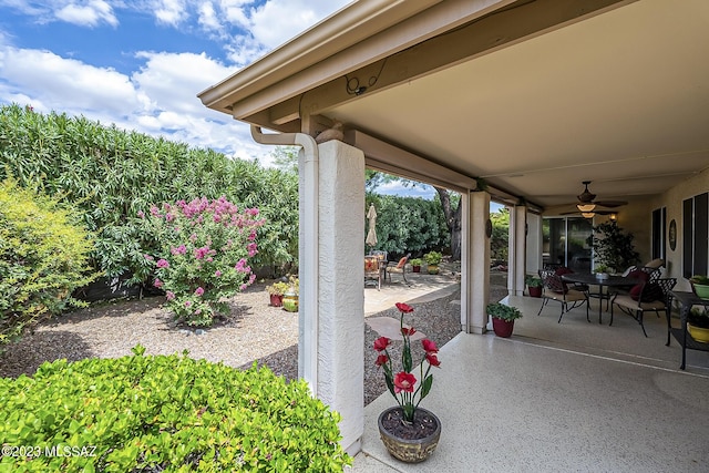 view of patio with ceiling fan and outdoor dining area