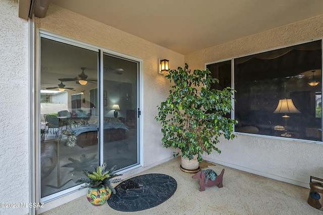 view of exterior entry featuring stucco siding