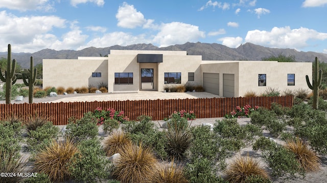 pueblo revival-style home featuring a mountain view