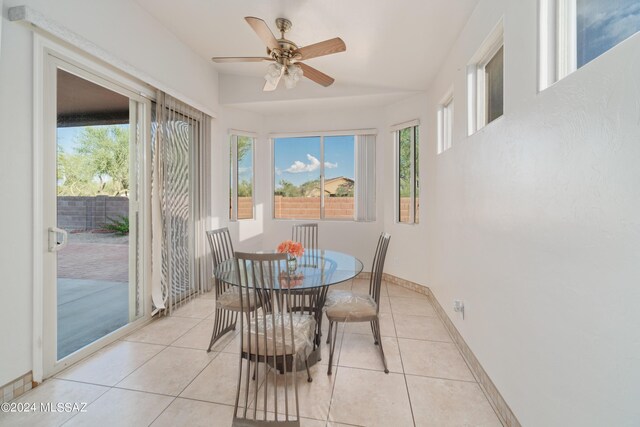 dining room featuring light tile patterned floors and ceiling fan