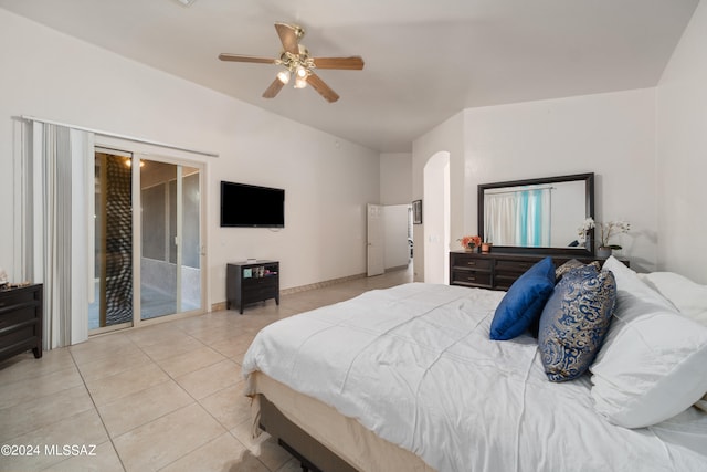 tiled bedroom featuring ceiling fan and access to exterior