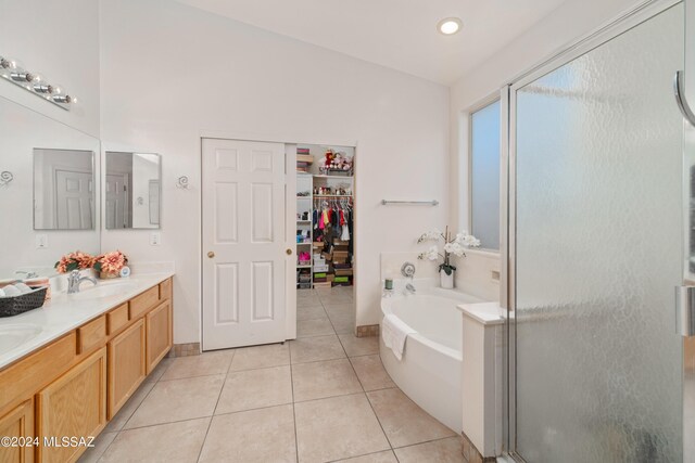 bathroom with vanity, shower with separate bathtub, and tile patterned flooring