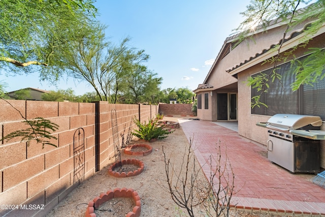 view of yard featuring a fenced backyard and a patio